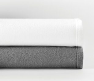 Shown stacked are the Express by app fleece blankets in White and Grey.